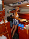 Marquesas Passage - Signe bracing herself in the galley - 98K